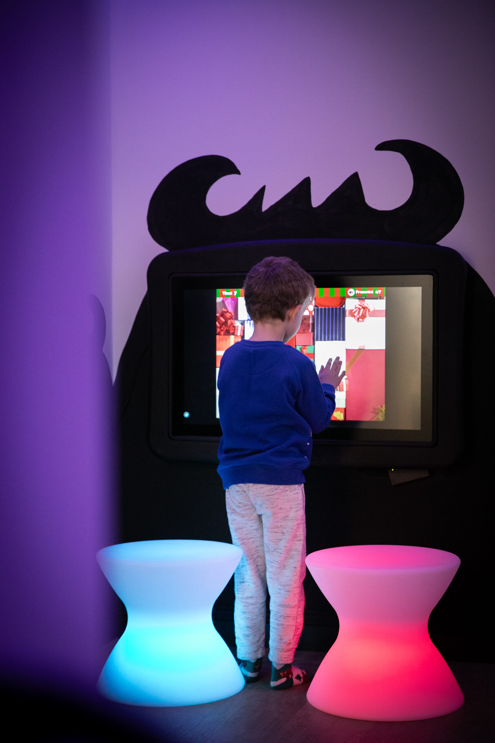 Children playing an interactive game at Small+Mighty
