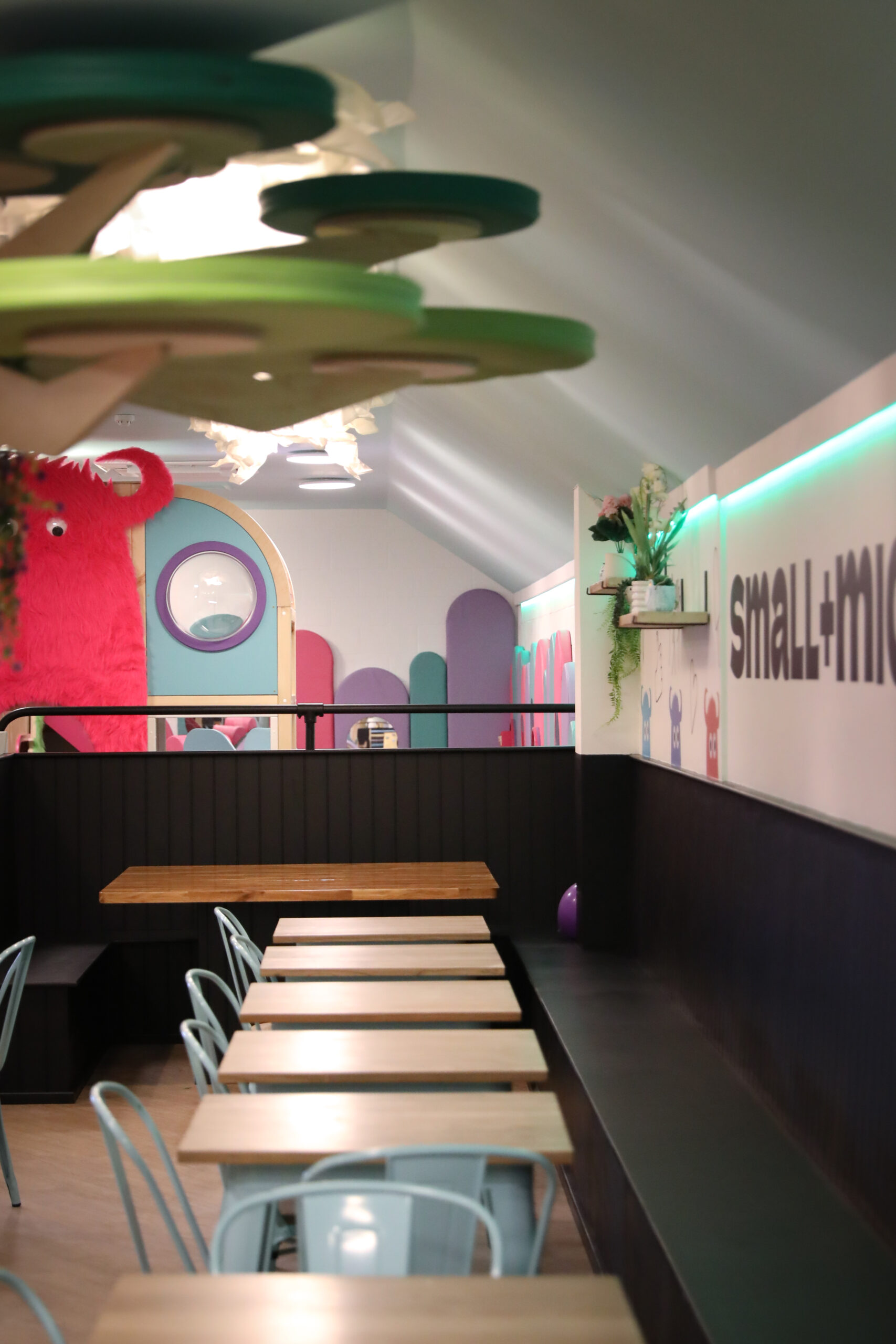 Café seating area at the heart of Small+Mighty's play space