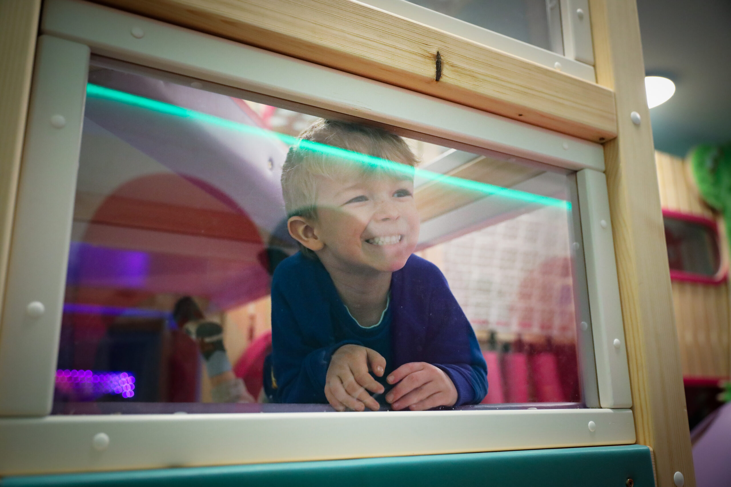 Child enjoying imaginative role play at Small+Mighty, Godalming